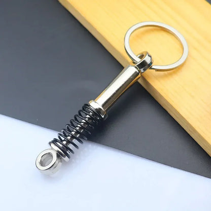Mini Zink-legierung Auto Teile Schlüsselanhänger Simulierte Geschwindigkeit Getriebe Absorber Motor Kolben Anhänger Auto Schlüssel Halter Schlüsselring Nette Männer Geschenk