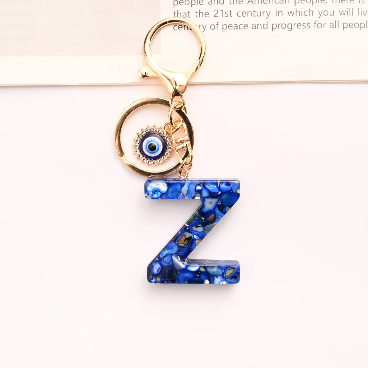 Neuer königsblauer Schlüsselanhänger mit 26 englischen Buchstaben, Devil's Eye, Taschenanhänger für Damen mit Großbuchstaben
