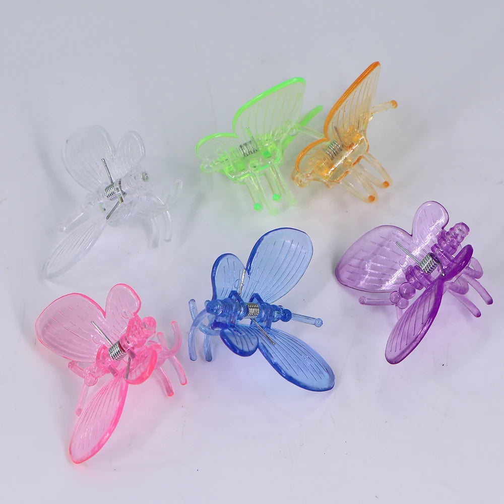 100 stücke Kunststoff-Pflanzen clips im Schmetterlings stil mit 4-Klauen-Orchideenblüten unterstützen Klammern, die den gebundenen Bündel zweig des Weinreben stiel verschlusses erklimmen