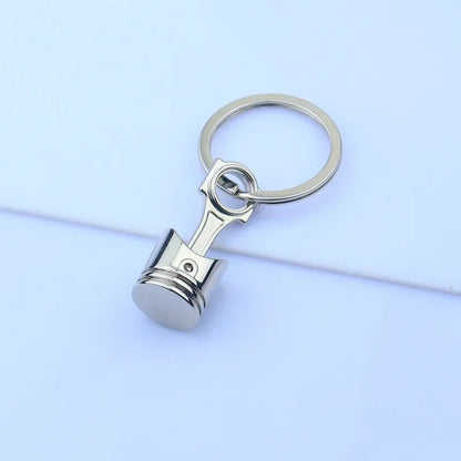 Mini Zink-legierung Auto Teile Schlüsselanhänger Simulierte Geschwindigkeit Getriebe Absorber Motor Kolben Anhänger Auto Schlüssel Halter Schlüsselring Nette Männer Geschenk