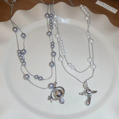 Mit Diamanten besetzte Saturn-Wassertropfen-Perlenkette, französische, leichte, luxuriöse Premium-Pulloverkette, vielseitiges Weihnachts- und Geburtstagsgeschenk