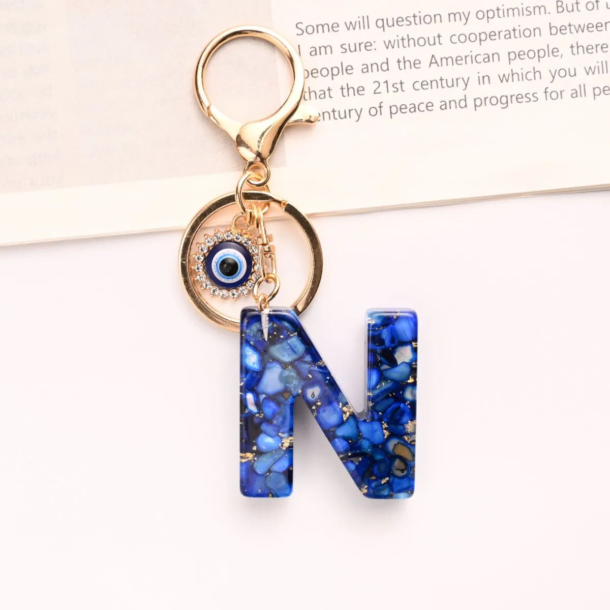 Neuer königsblauer Schlüsselanhänger mit 26 englischen Buchstaben, Devil's Eye, Taschenanhänger für Damen mit Großbuchstaben