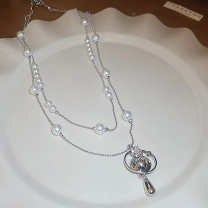 Mit Diamanten besetzte Saturn-Wassertropfen-Perlenkette, französische, leichte, luxuriöse Premium-Pulloverkette, vielseitiges Weihnachts- und Geburtstagsgeschenk