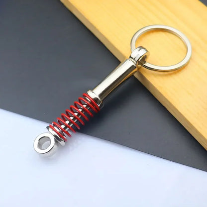 Mini Zink-legierung Auto Teile Schlüsselanhänger Simulierte Geschwindigkeit Getriebe Absorber Motor Kolben Anhänger Auto Schlüssel Halter Schlüsselring Nette Männer Geschenk