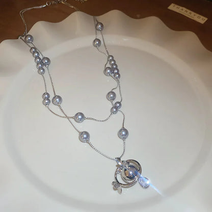 Mit Diamanten besetzte Saturn-Wassertropfen-Perlenkette, französische, leichte, luxuriöse Premium-Pulloverkette, vielseitiges Weihnachts- und Geburtstagsgeschenk